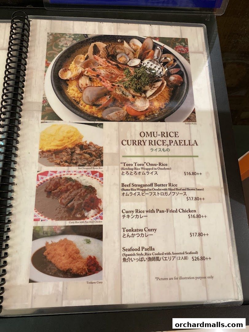 A menu page from Ma Maison featuring Omu-rice, curry dishes, and paella.