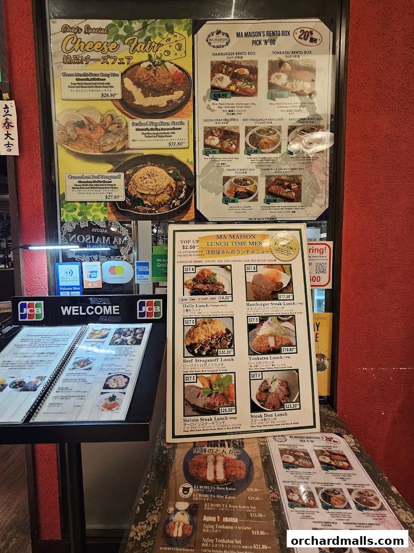 A display of menus and food offerings from Ma Maison restaurant.