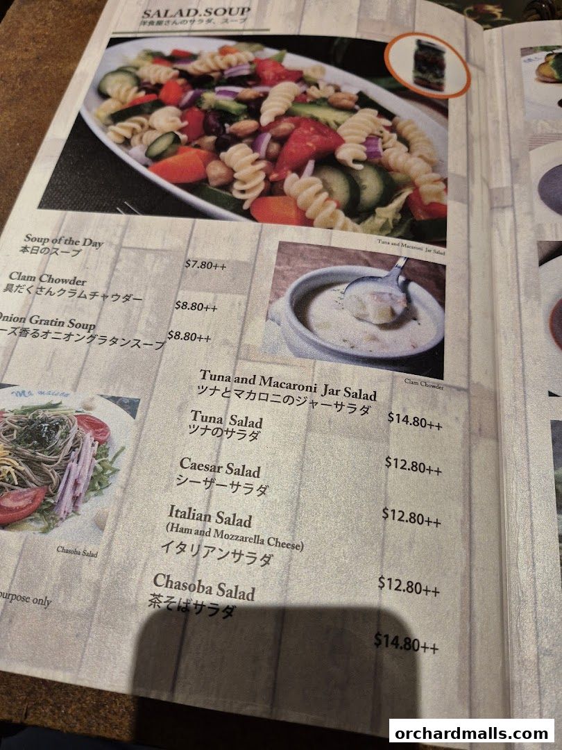 A menu page from Ma Maison featuring salads and soups with prices.