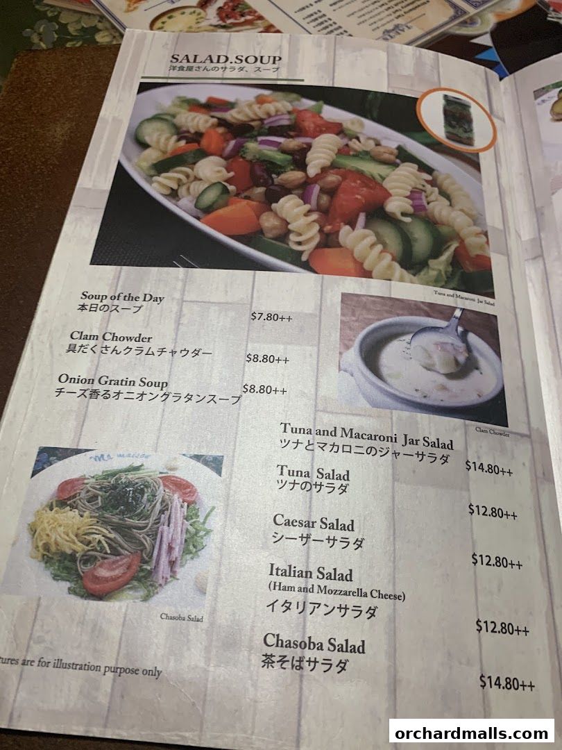 A menu page from Ma Maison featuring salads and soups with images and prices.