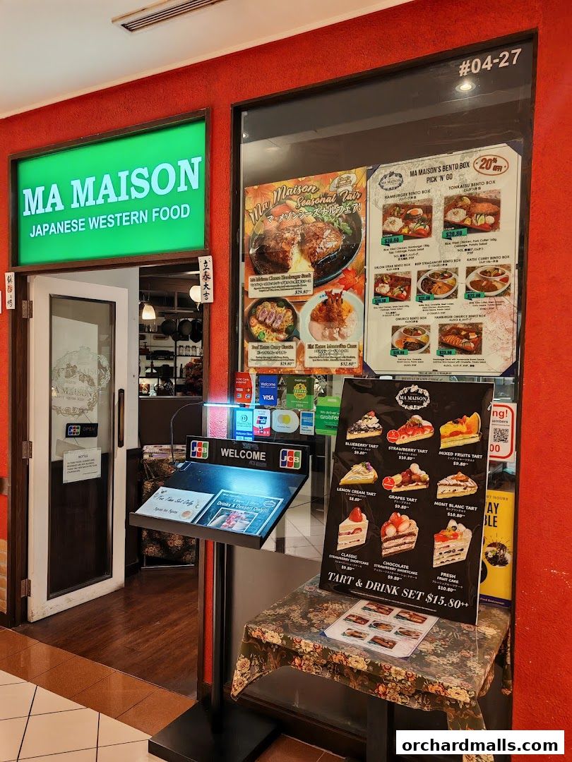 The entrance of Ma Maison, a Japanese Western food restaurant, with menus displayed outside.