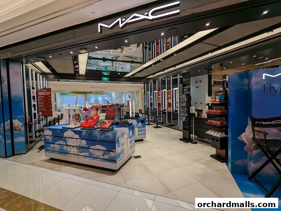 MAC Cosmetics store interior with makeup displays and product shelves.