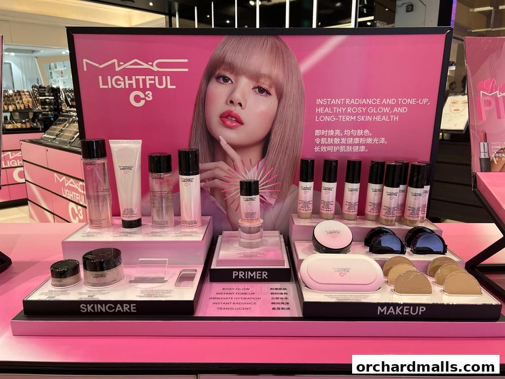 MAC Cosmetics display featuring Lightful C3 skincare and makeup products with a model.