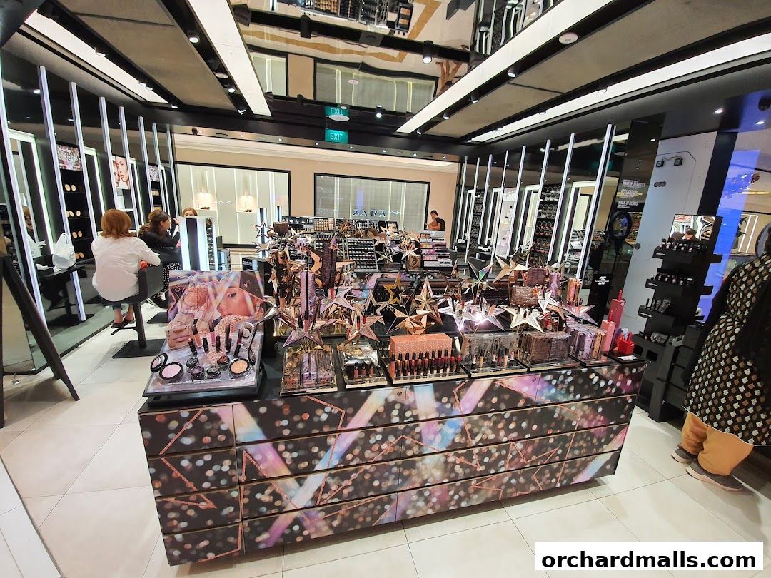 Interior of a MAC Cosmetics store showcasing makeup products and displays.