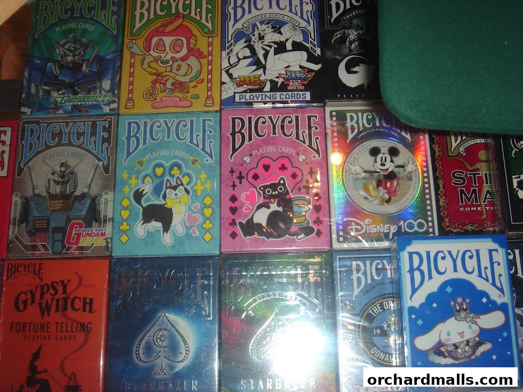 A collection of various Bicycle playing cards with different designs and themes.