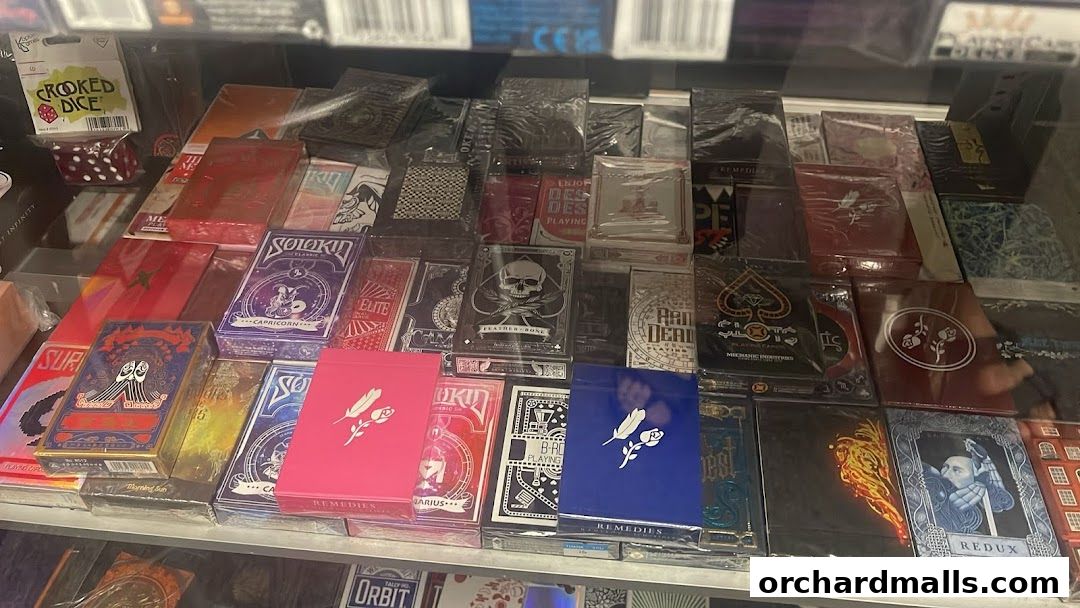 A display of various decks of playing cards with intricate designs and artwork.