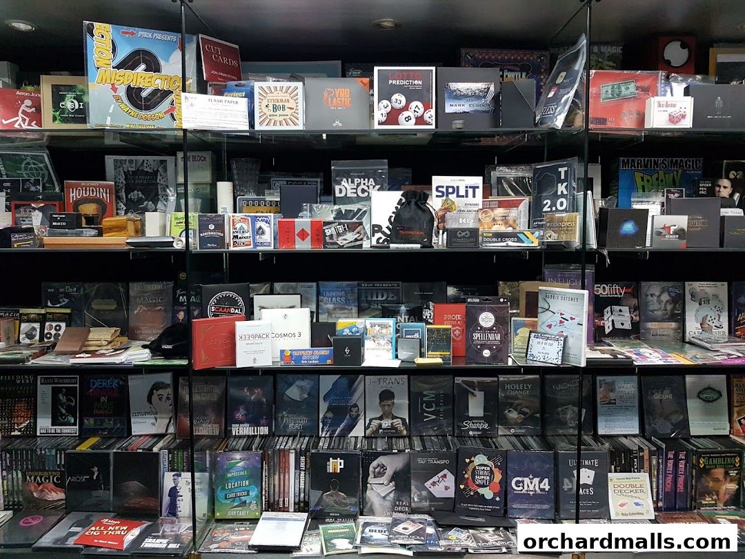 A wide selection of magic tricks, books, and accessories are displayed on shelves.