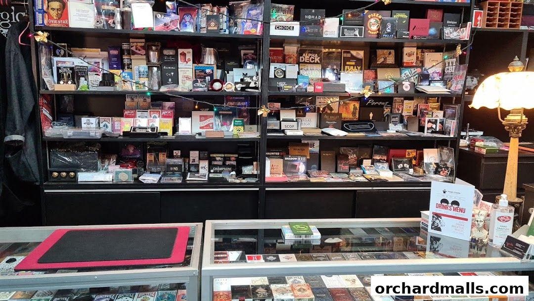 A shop interior filled with shelves of magic tricks, playing cards, and novelty items.