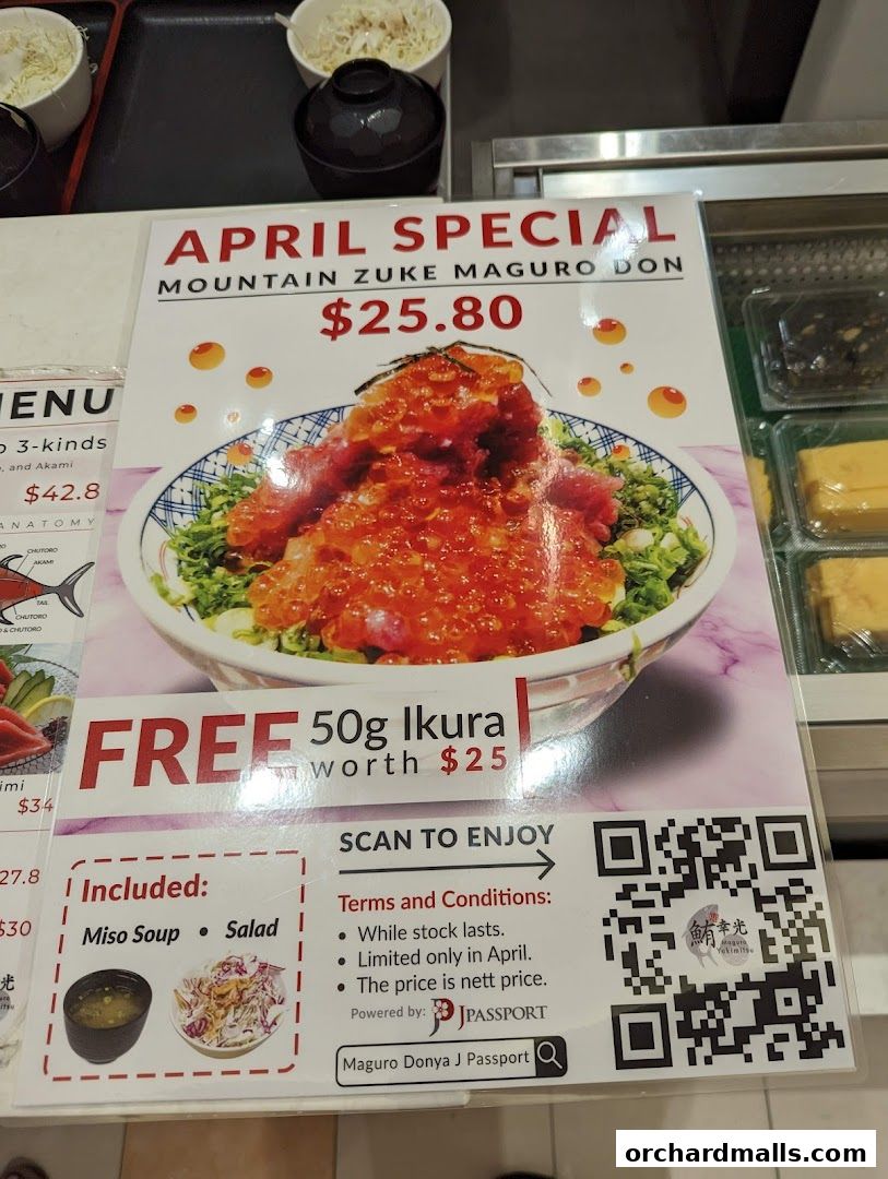 A sign advertising an April special of Mountain Zuke Maguro Don with free Ikura.