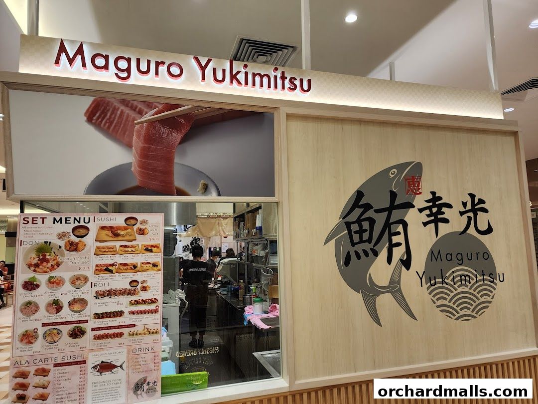 The exterior of Maguro Yukimitsu, a Japanese restaurant, featuring its name and a large tuna image.