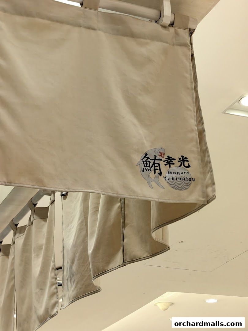 A beige curtain with the shop name 'Maguro Yukimitsu' and a fish logo.
