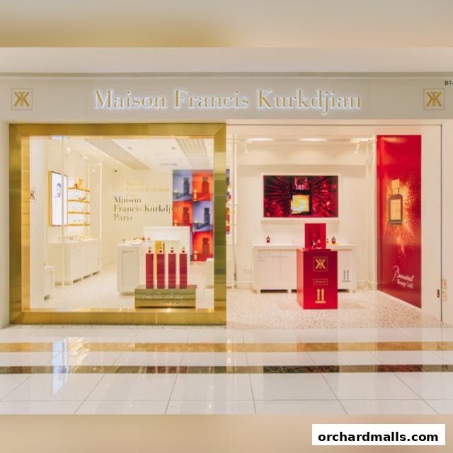 The elegant Maison Francis Kurkdjian store entrance with illuminated signage and product displays.