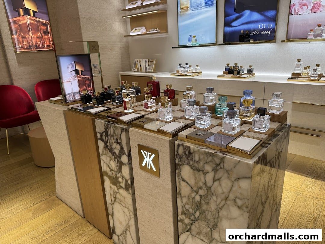 Interior view of a Maison Francis Kurkdjian store showcasing various perfumes on display.