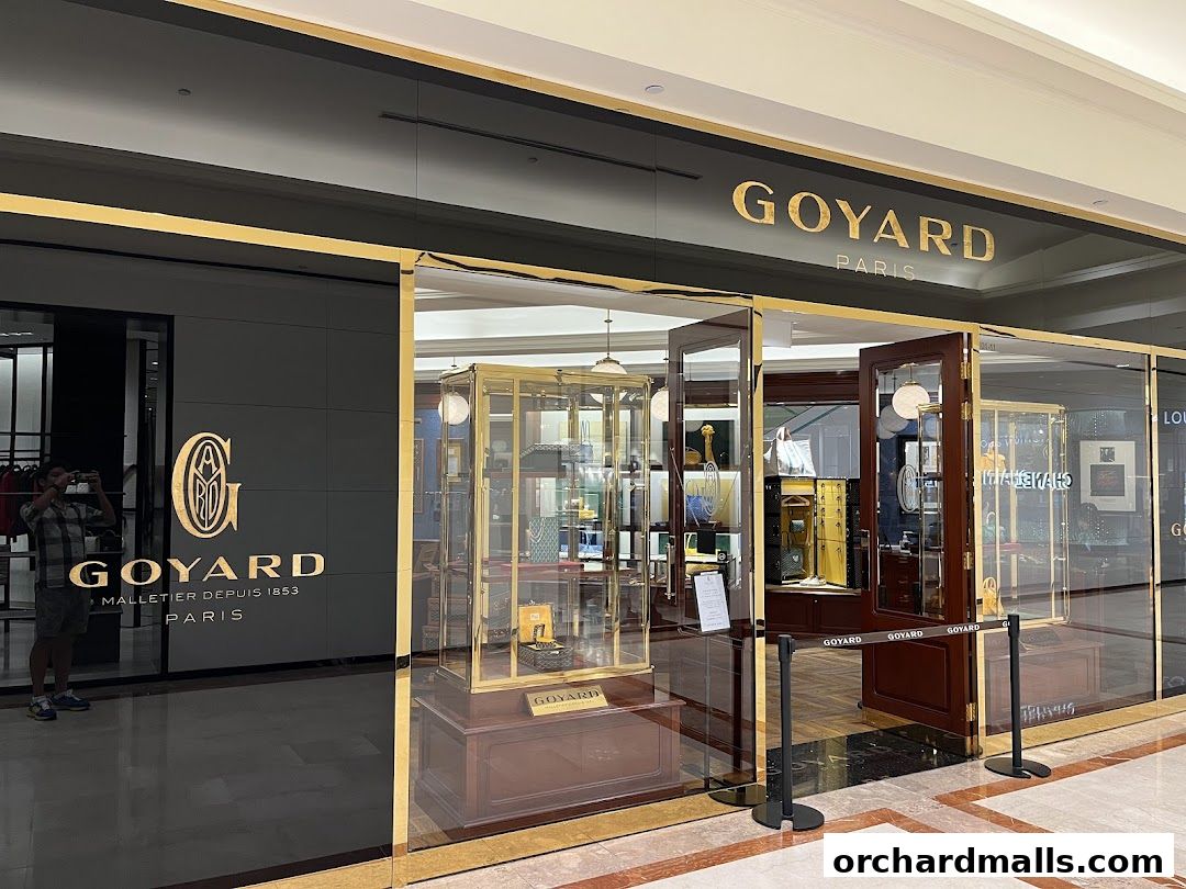 The elegant storefront of Maison Goyard Singapore Takashimaya, showcasing luxury goods in display cases.