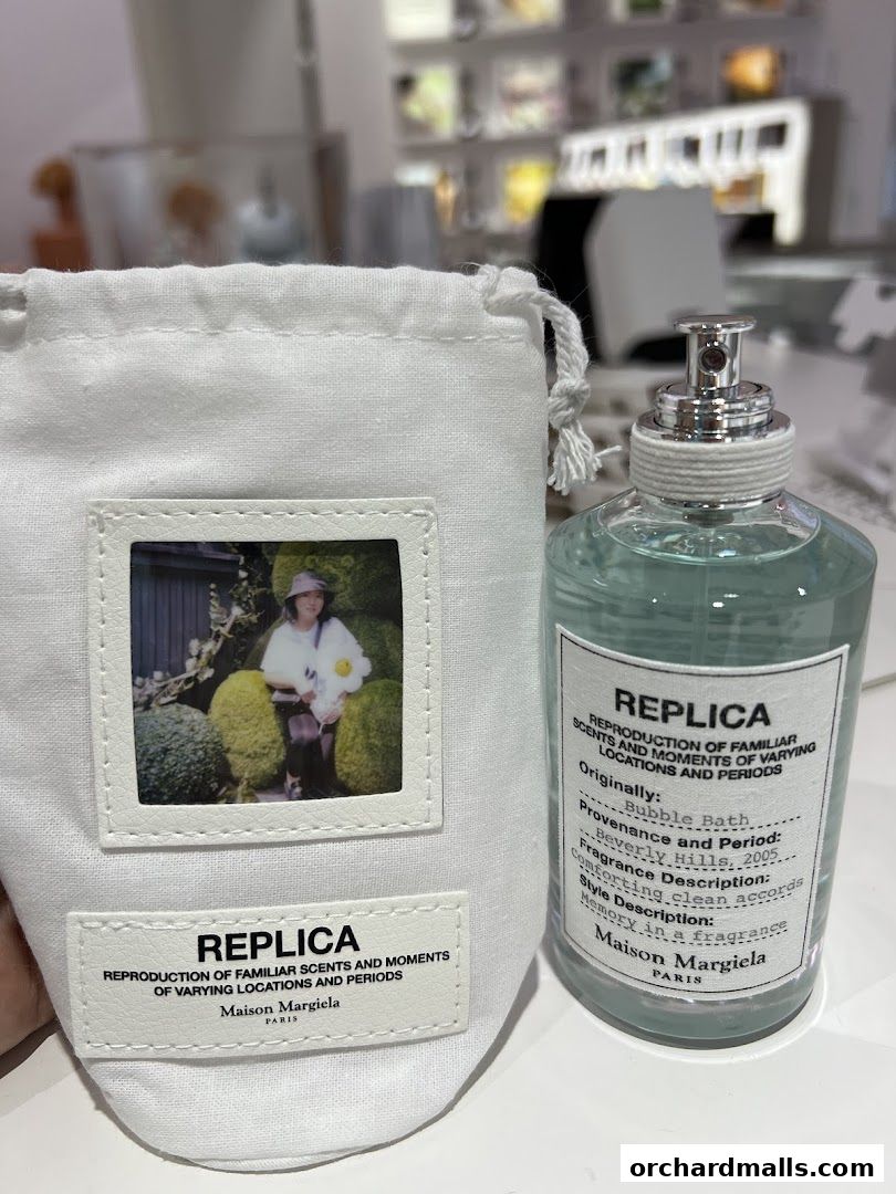 Maison Margiela REPLICA perfume bottle and pouch with a vintage photo.