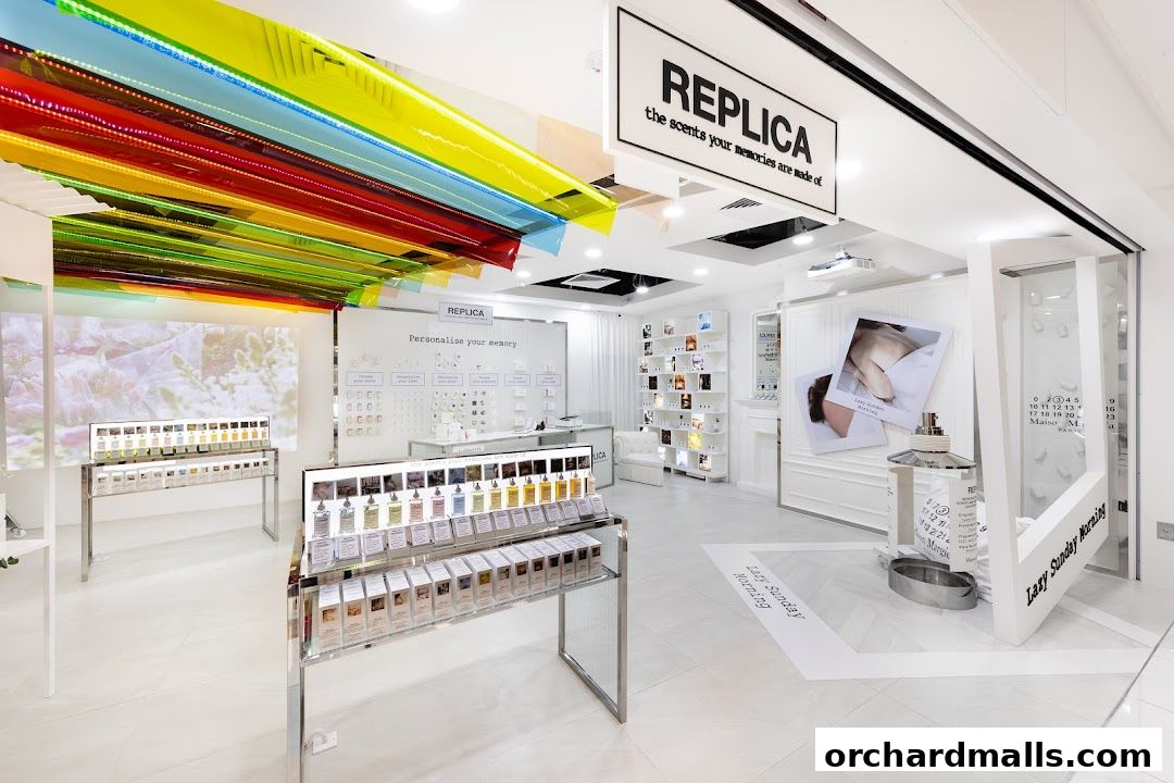 Interior of a Maison Margiela REPLICA fragrance store with perfume displays and colorful ceiling decor.