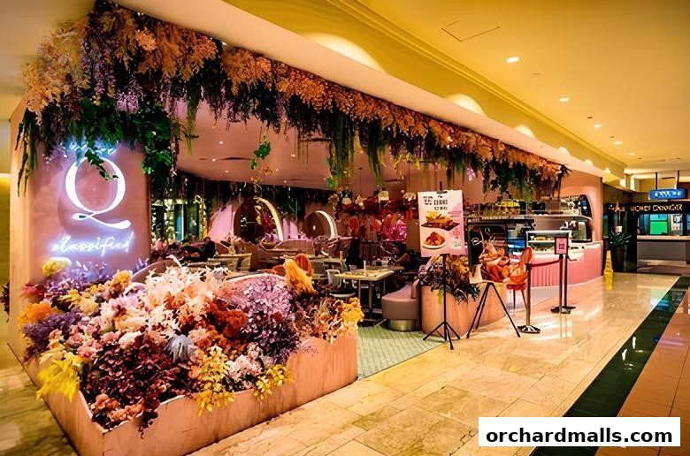 A beautifully decorated cafe with abundant floral arrangements and neon signage.