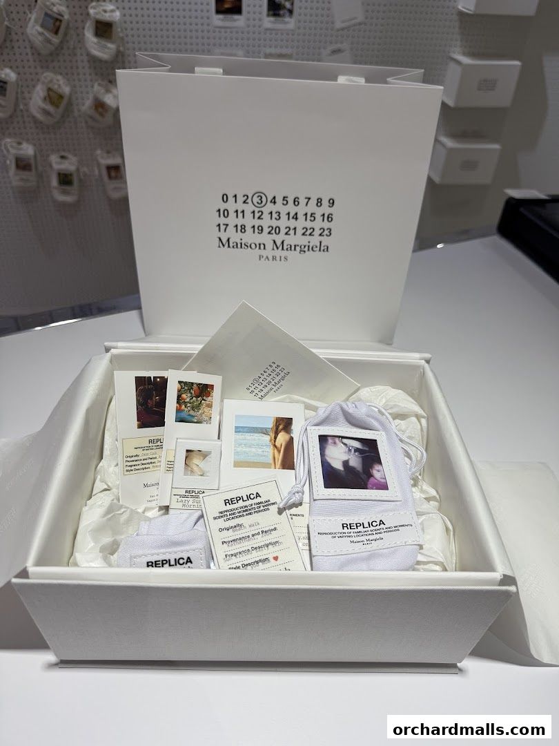 Maison Margiela REPLICA fragrance set with samples and branded packaging.