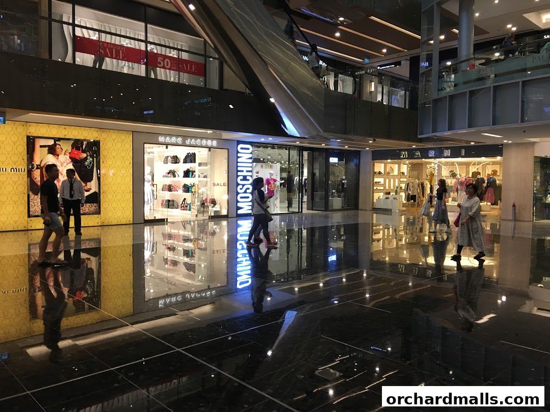 A view of the Marc Jacobs store entrance and interior in a modern shopping mall.