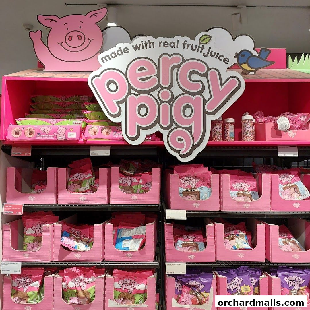 A display of 'Percy Pig' sweets made with real fruit juice.