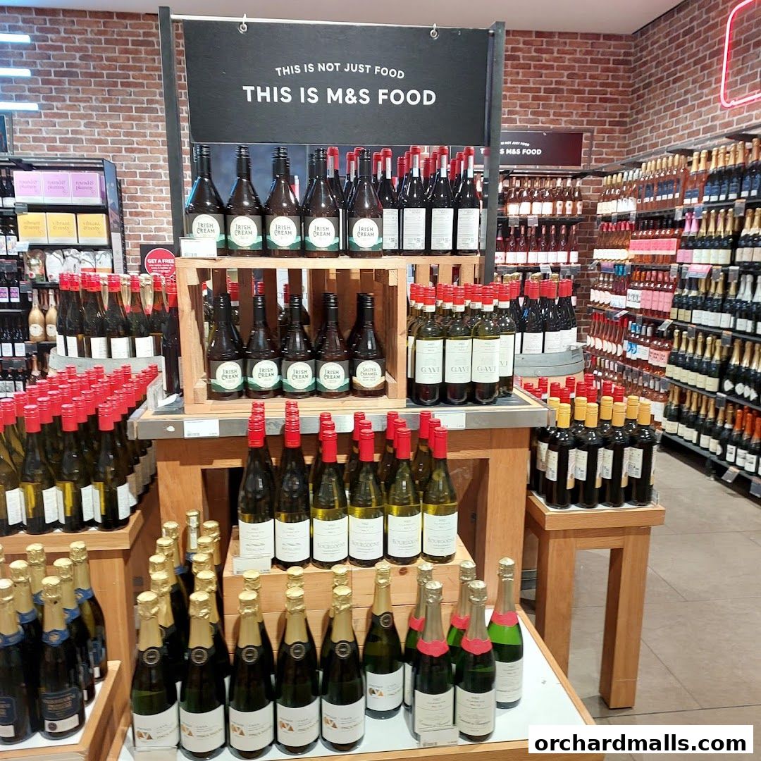 A display of various alcoholic beverages, including wine and Irish cream liqueur, at Marks & Spencer.
