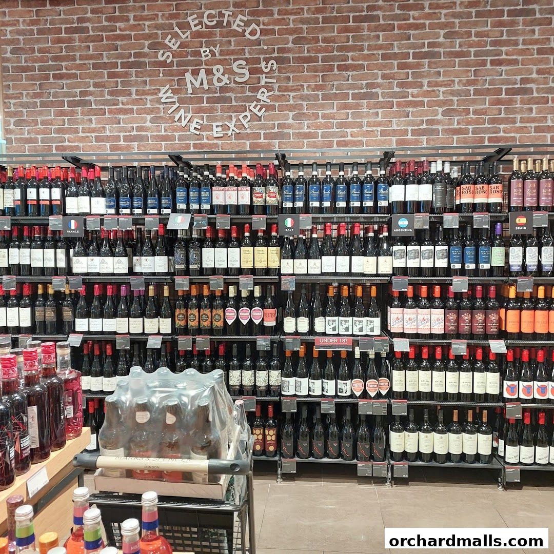 A wide selection of wines displayed on shelves in a retail store.