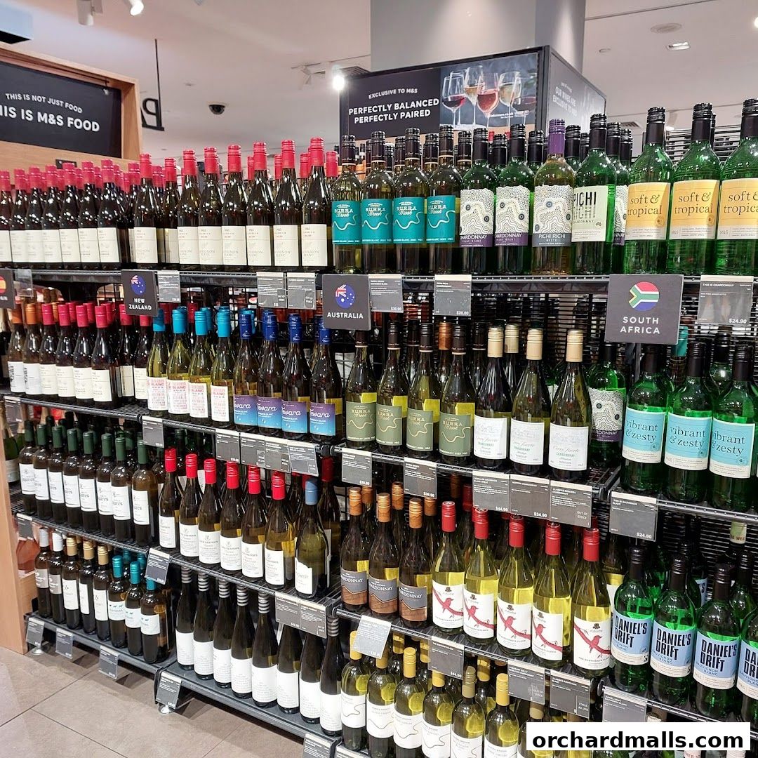 A wide selection of wine bottles displayed on shelves in a retail store.