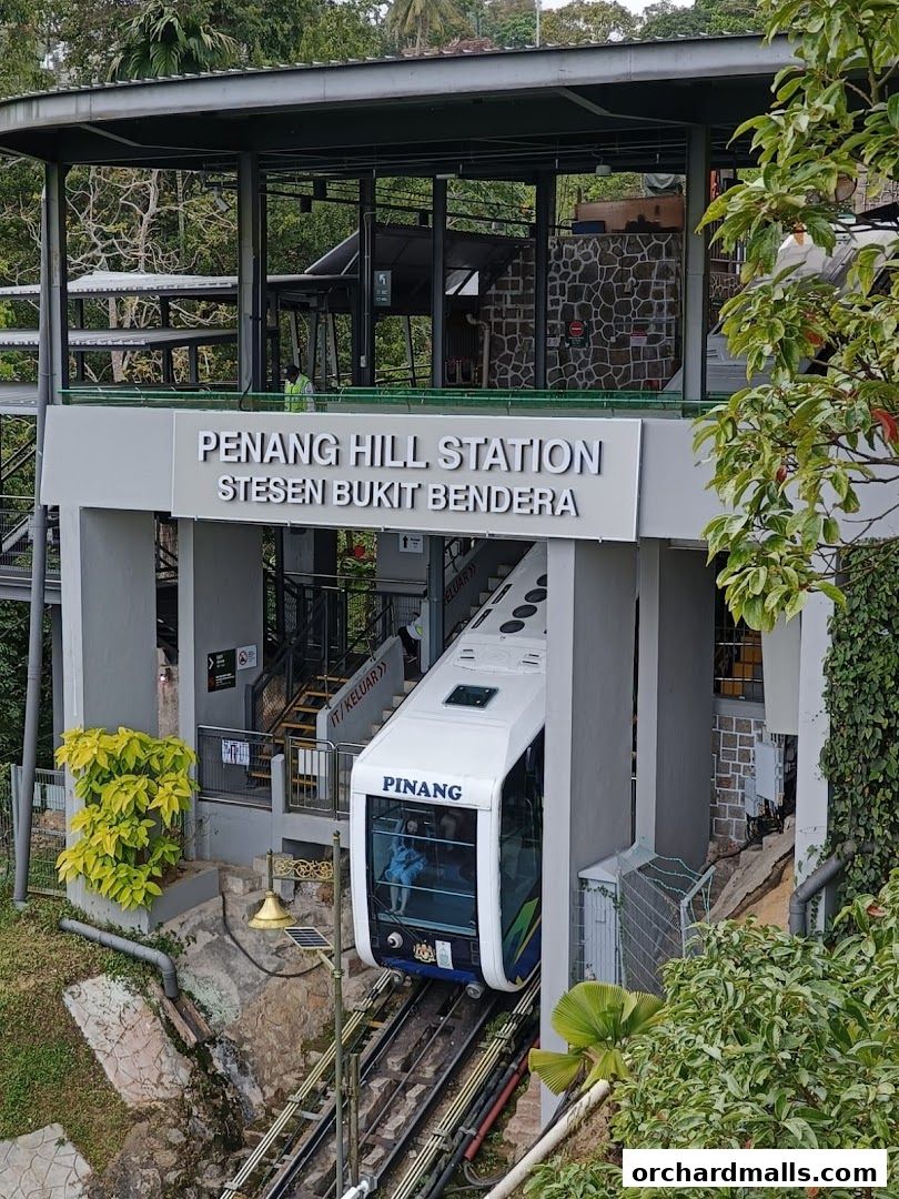 Penang Hill Station funicular train arriving at the station entrance.