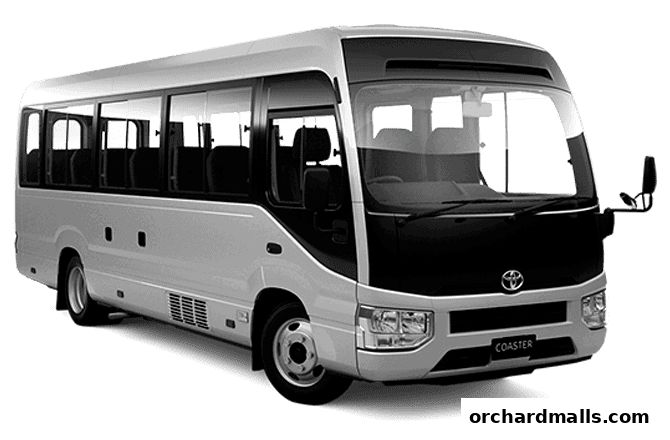 A white and black Toyota Coaster bus with tinted windows.