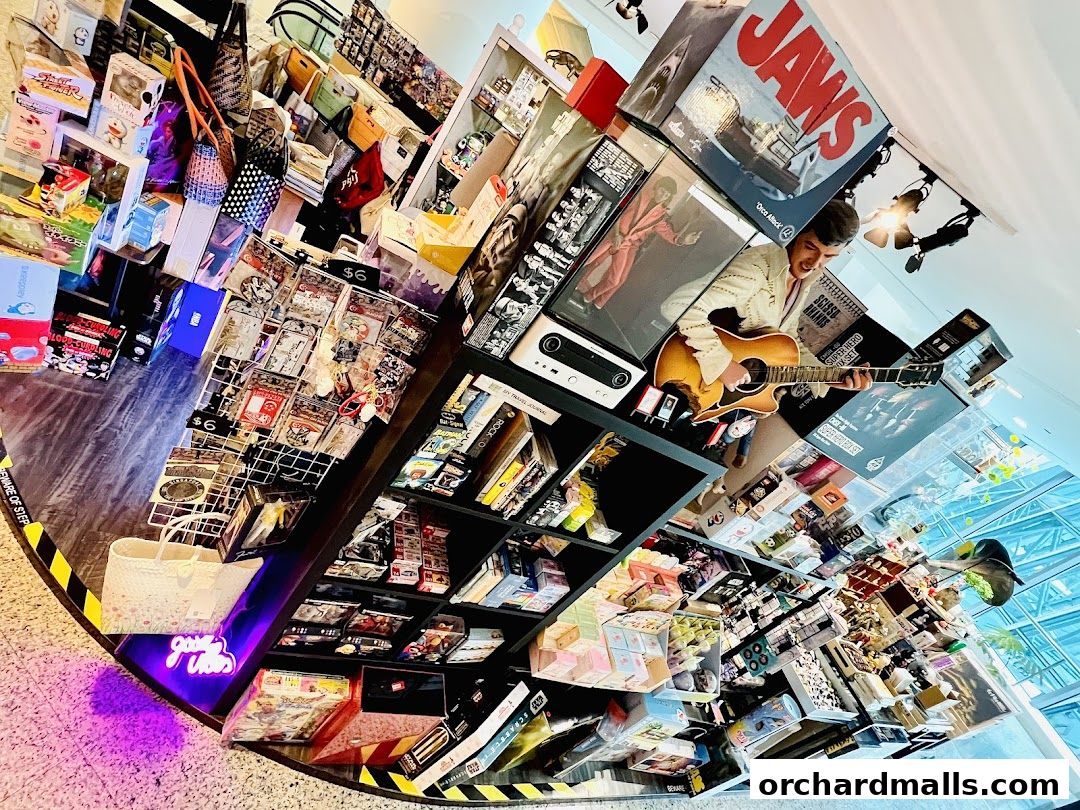A retail shop interior filled with various merchandise, including posters, books, and novelty items.