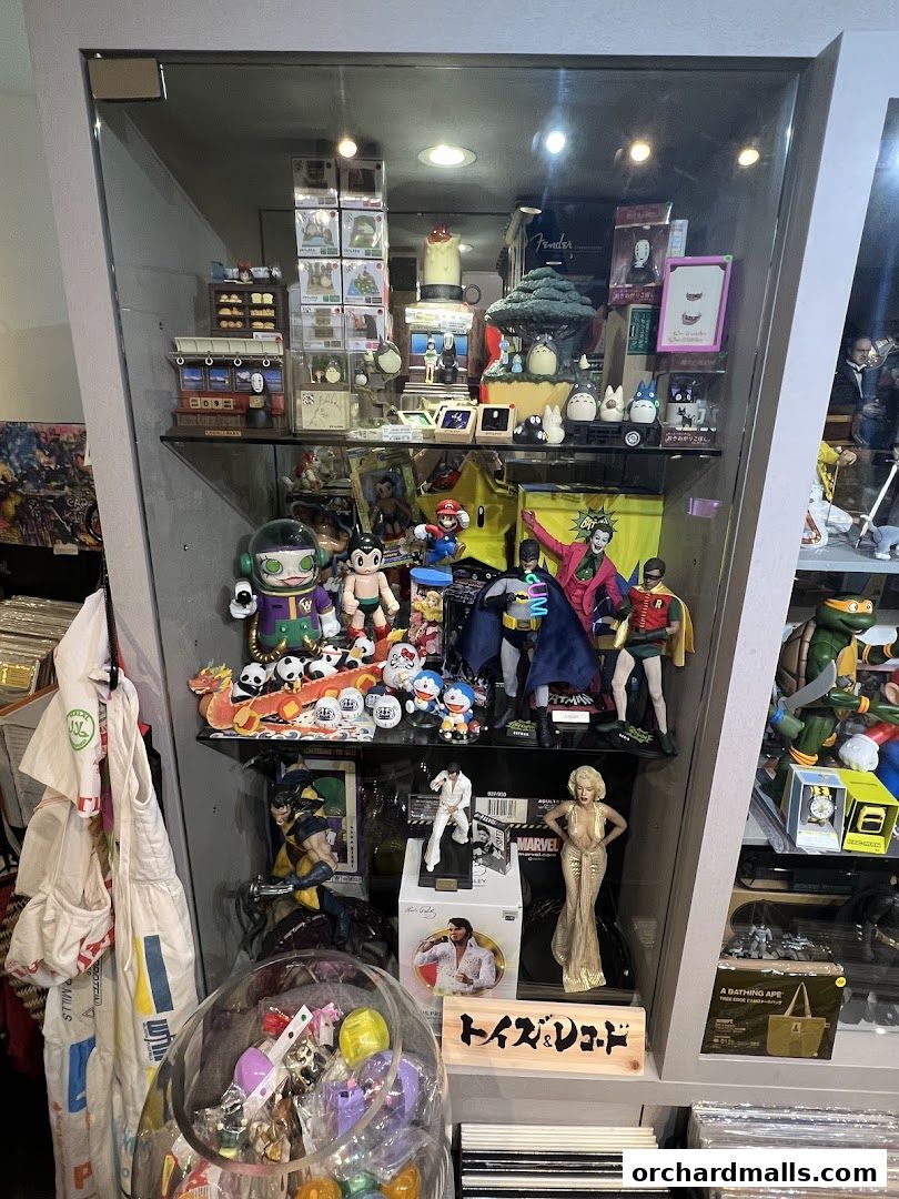 A display cabinet filled with various collectible figures and merchandise.