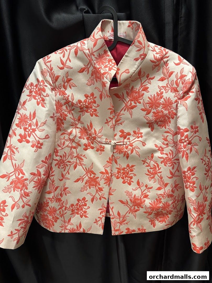 A cream-colored jacket with a red floral pattern and a mandarin collar.