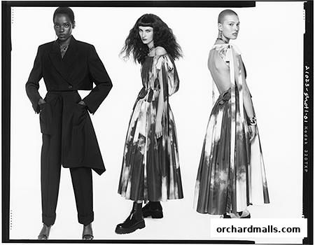 Three models showcase avant-garde fashion, featuring dramatic silhouettes and unique prints.
