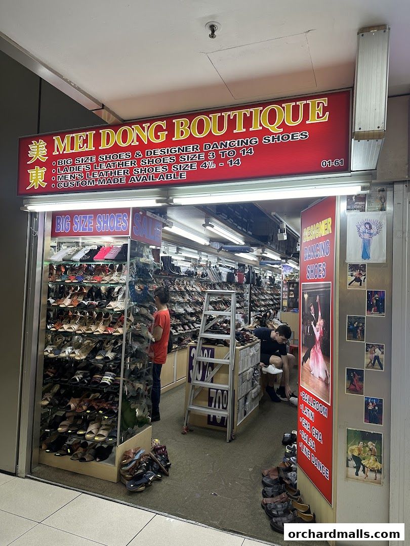 Mei Dong Boutique shop front displaying a wide selection of shoes, including big size and designer dancing shoes.