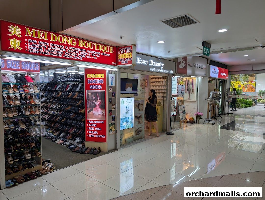 Mei Dong Boutique shop front displaying a wide selection of shoes, including big size and designer dancing shoes.