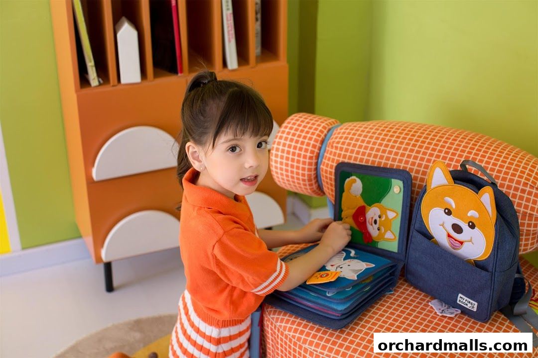 A young girl plays with a felt book featuring dog and cat characters.