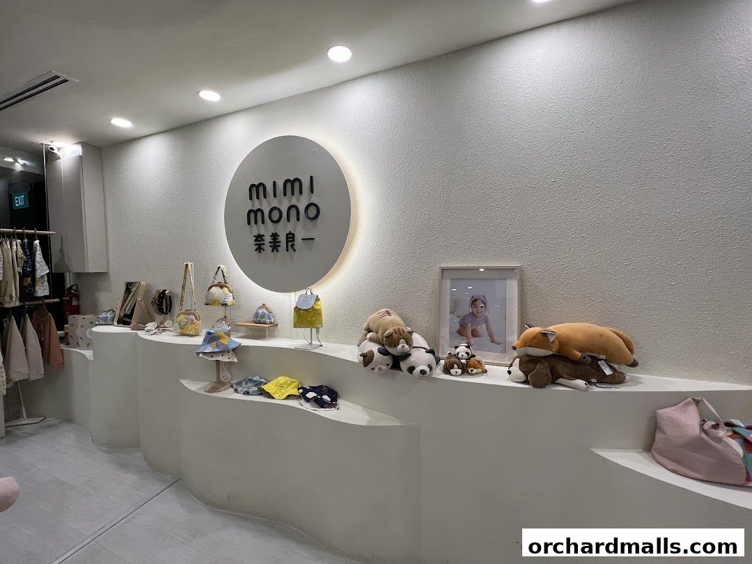 Interior view of Mimi Mono store showcasing children's clothing, bags, and plush toys.