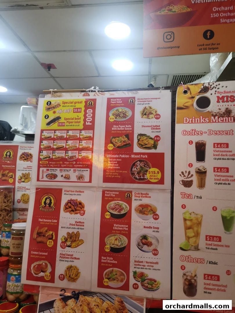A menu board displaying Vietnamese food and drinks with prices and descriptions.