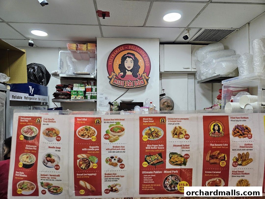 A menu board displaying various Vietnamese dishes and desserts with prices.