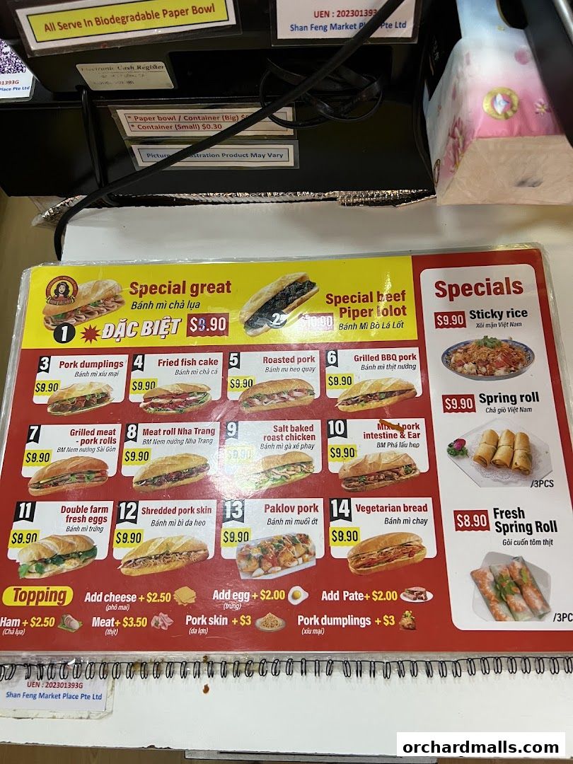 A menu board displaying various Vietnamese banh mi sandwiches and specials.
