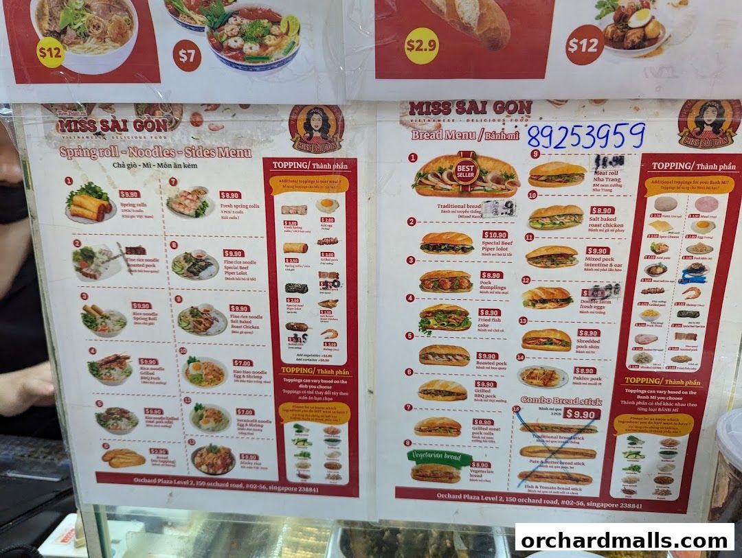 A menu for Miss Saigon Singapore featuring spring rolls, noodles, sides, and bread items with prices.