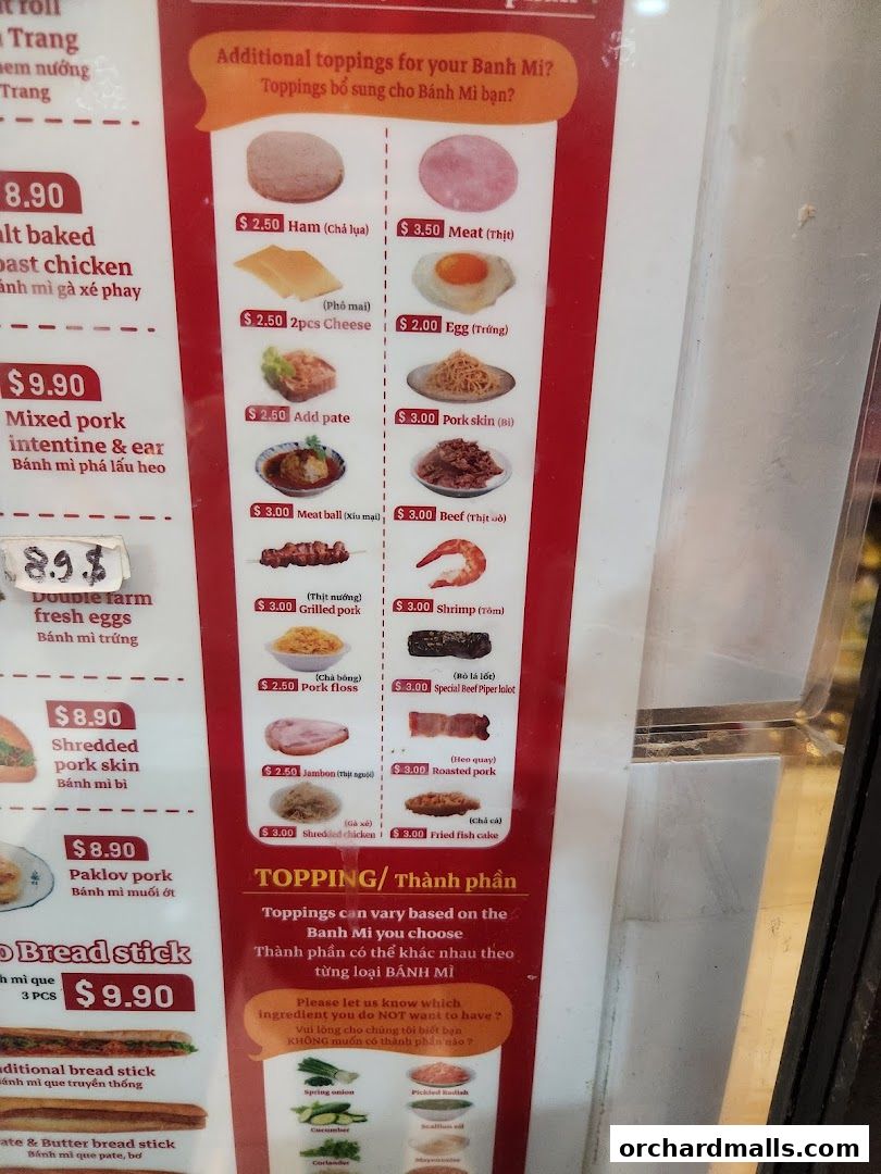 A menu board displaying various Banh Mi toppings and their prices.