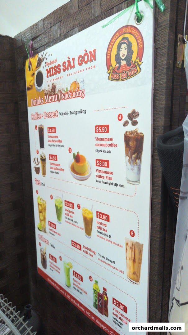 A menu board for Miss Saigon Singapore featuring Vietnamese drinks and desserts.