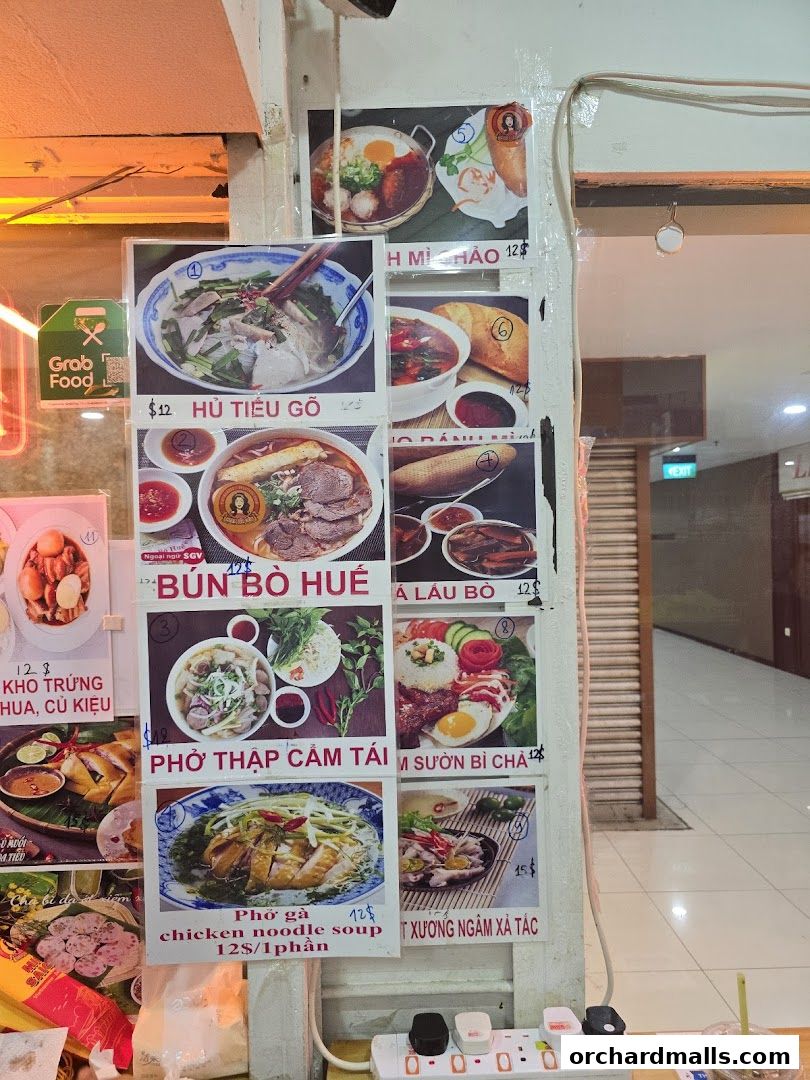 A display of Vietnamese food dishes with prices and descriptions.