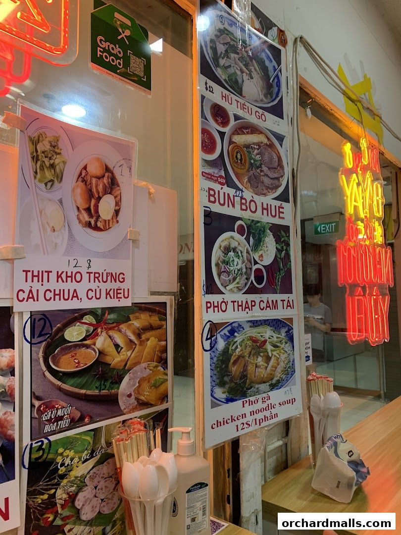 A display of Vietnamese food items with prices and descriptions.