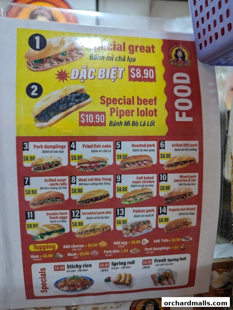 A menu board displaying various Vietnamese banh mi sandwiches and other food items with prices.