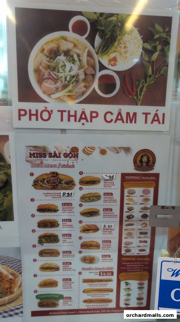 A menu for Miss Saigon Singapore featuring pho and various banh mi options.