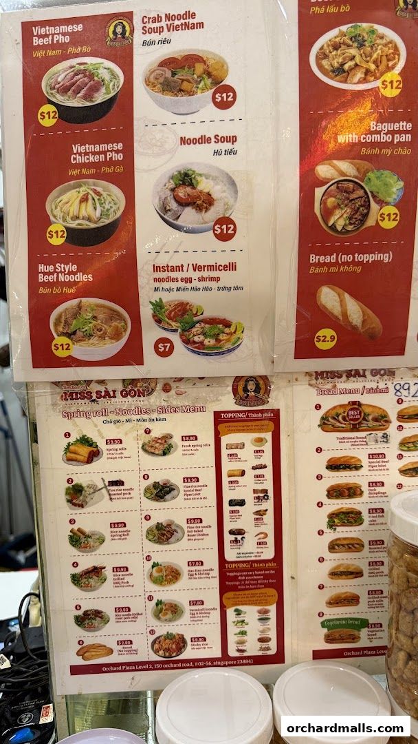 A menu from Miss Saigon Singapore featuring Vietnamese dishes like Pho, noodles, and baguettes.