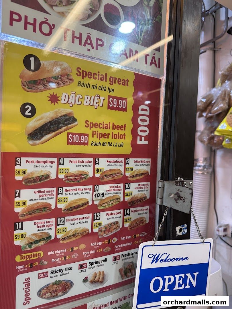 A menu board displaying various Vietnamese banh mi sandwiches and other food items with prices.