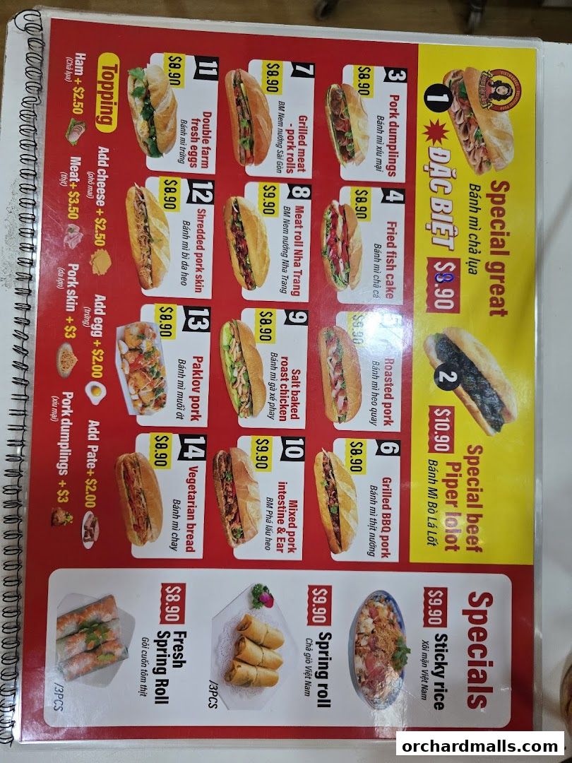 A menu for Miss Saigon Singapore featuring various banh mi, spring rolls, and sticky rice dishes.